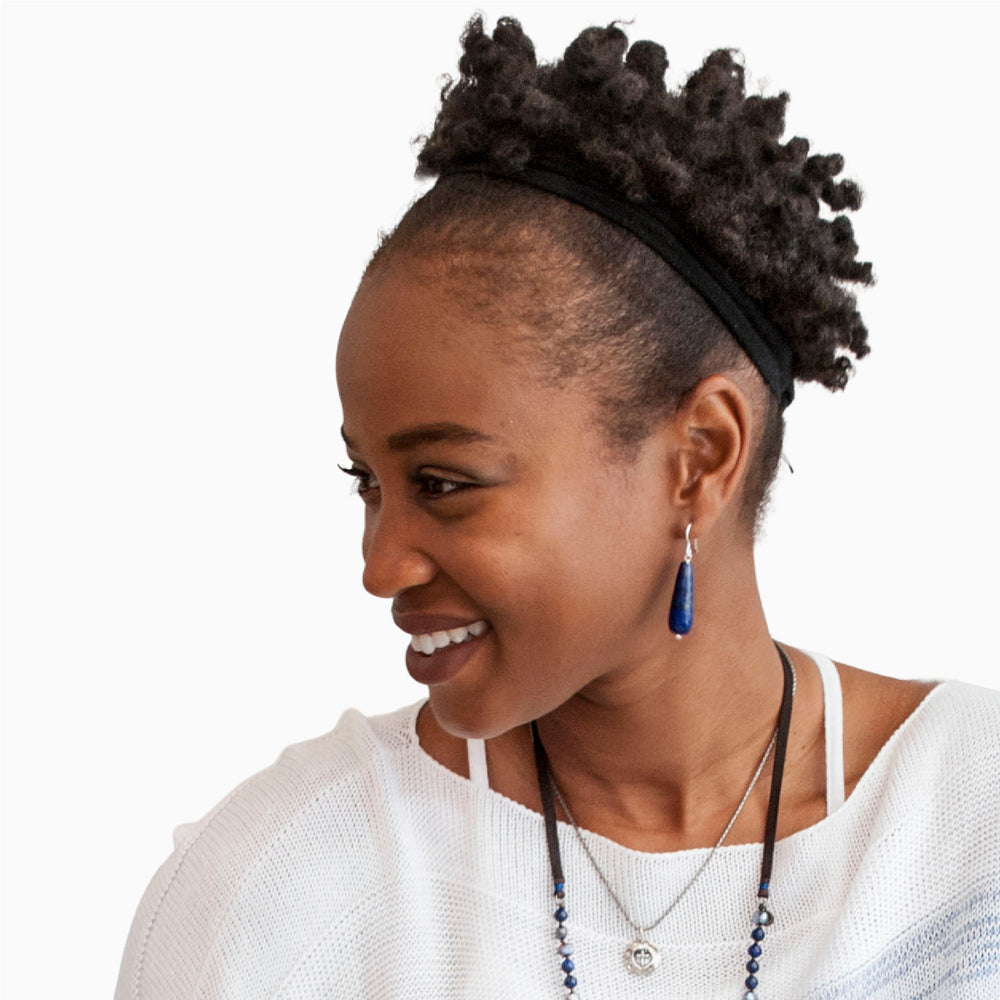 Silver earrings with long tear drops of lapis on .925 sterling silver French Earwires. RockHill Exclusive. Shown on a model.