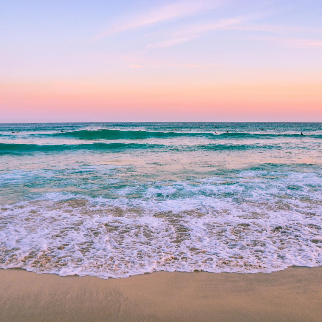 Beach and ocean scene in soft coastal colors that inspire RockHill Designs jewelry.