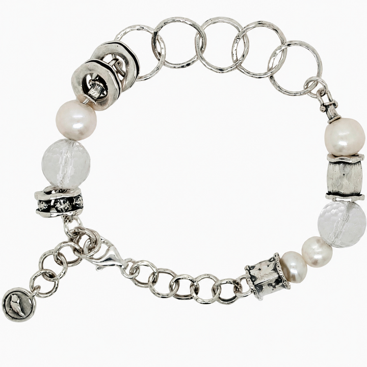 Shine On Bracelet with faceted clear quartz, white freshwater pearls, sterling silver beads, lobster clasp and adjustable chain on a white background.
