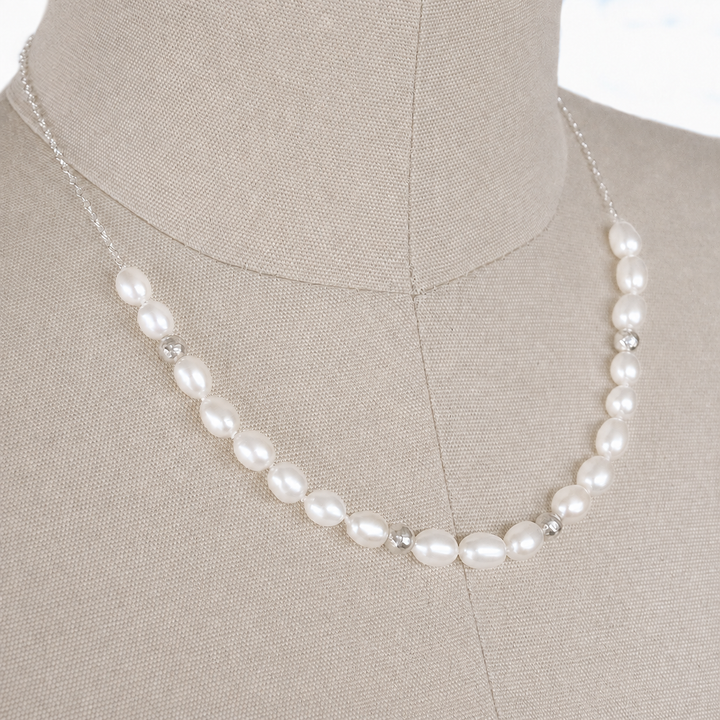 Perfect Pearl Necklace with sterling silver accent beads displayed on a bust.