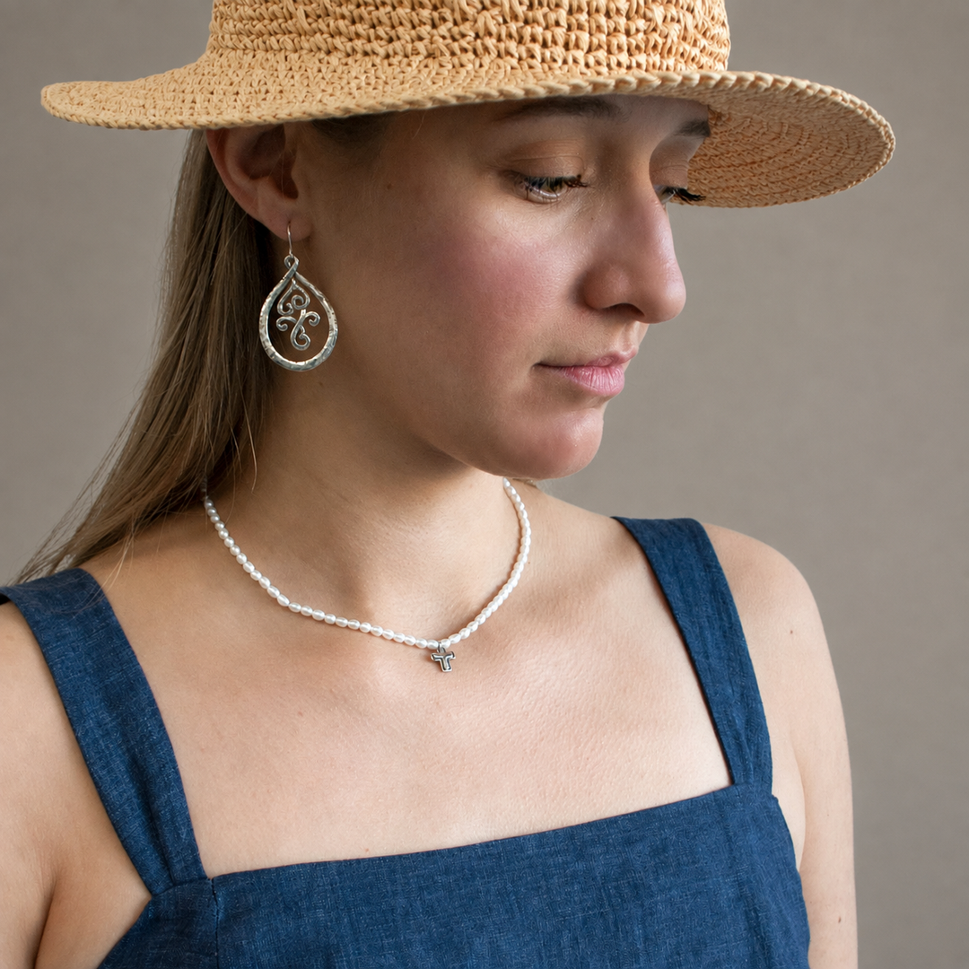 Graceful Cross Necklace with freshwater pearls and sterling silver cross pendant worn by model.