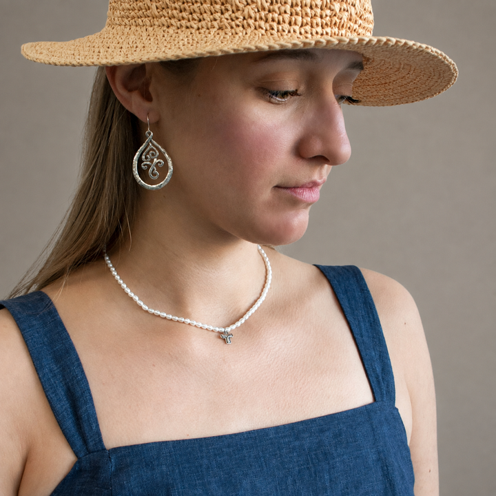 Graceful Cross Necklace with freshwater pearls and sterling silver cross pendant worn by model.