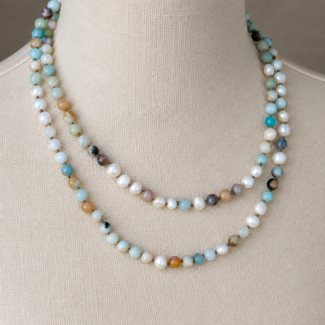 Peaceful Palette Necklace with amazonite and freshwater pearl beads displayed in a doubled layer on an off-white linen bust.