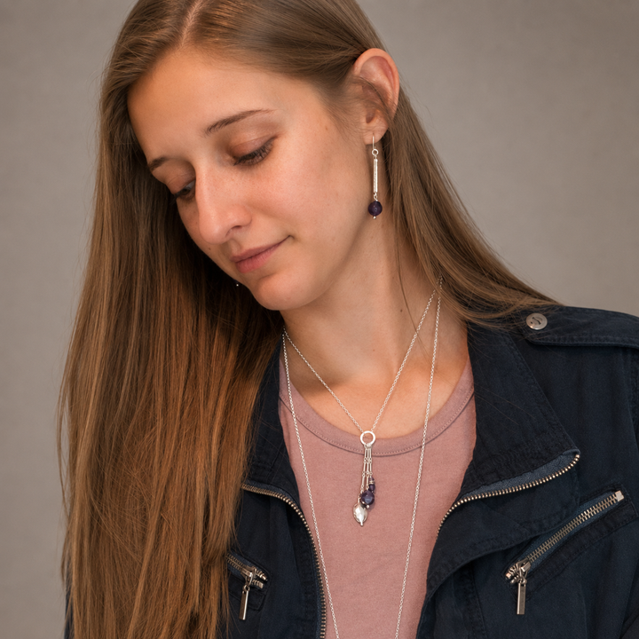 Royal Trio Necklace with silver and amethyst bead drop pendant worn by model.