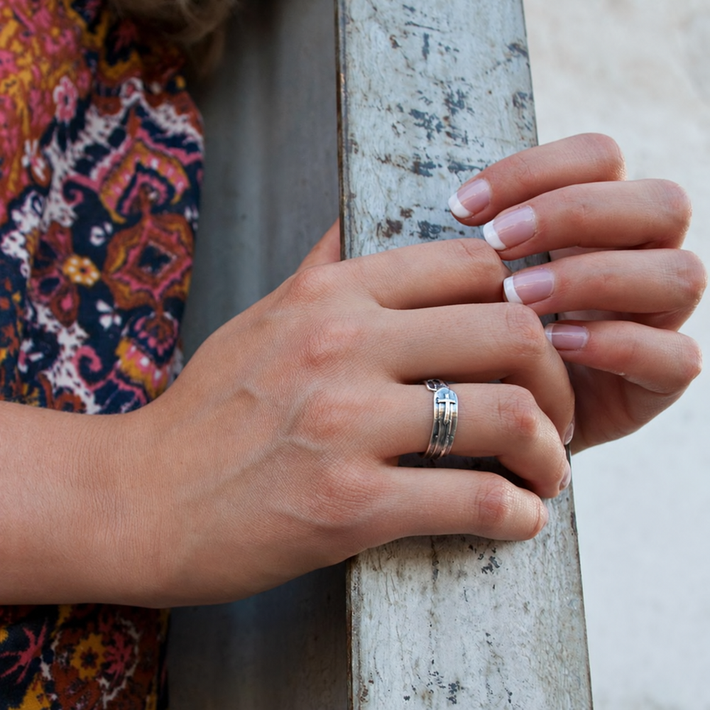 Model wearing the Simple Blessings sterling silver cross ring to show scale and fit.