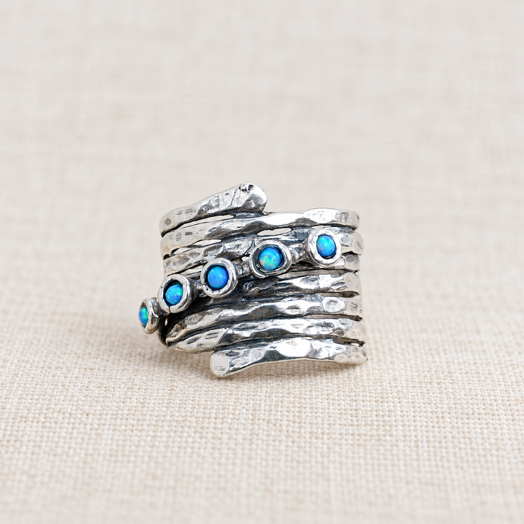 Opal Accents hammered sterling silver ring with round lab-created blue opals and textured wraparound band.