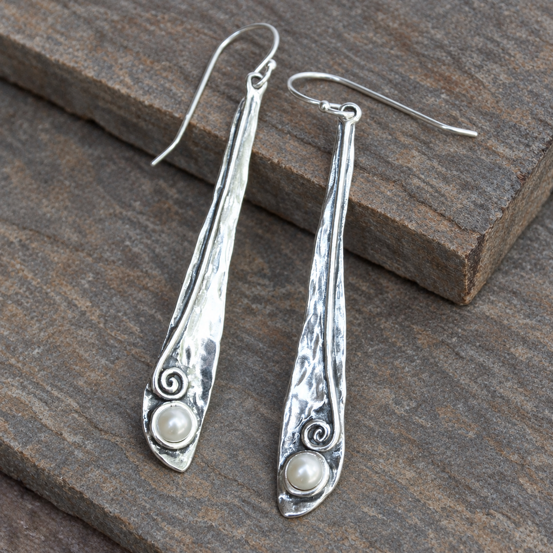 Pearly Vine Earrings with hammered sterling silver and freshwater pearls displayed on a soft grey-brown slate background