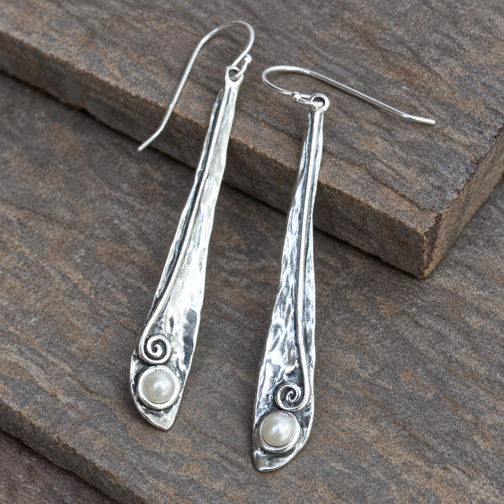 Pearly Vine Earrings with hammered sterling silver and freshwater pearls displayed on a soft grey-brown slate background