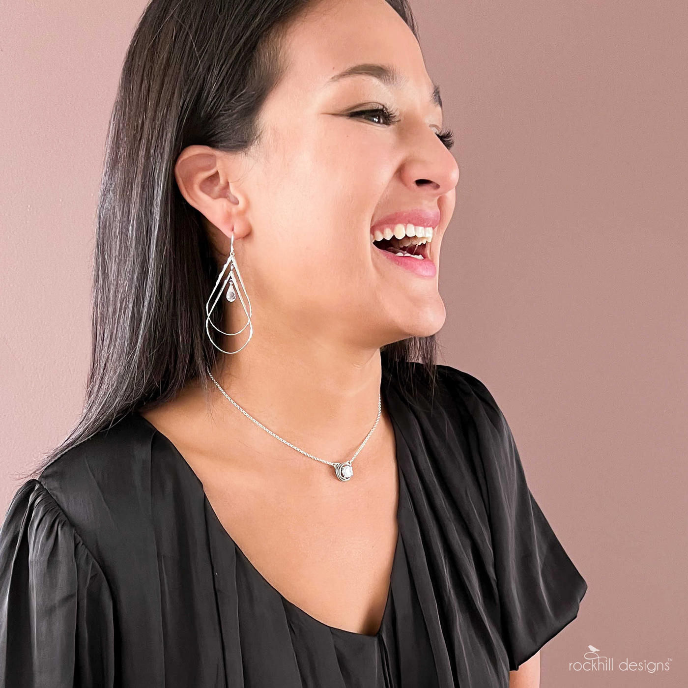 Silver Dangle Earrings- Large with double sterling silver tear-shaped drops. Features a dainty faceted clear cz within. Artisan-crafted, quality sterling silver earrings.Shown on a model.