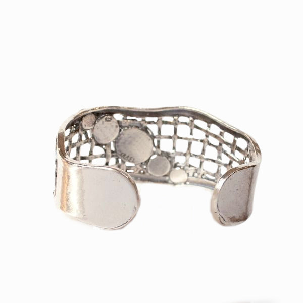 Silver Cuff Bracelet crafted with .925 sterling silver and with faceted black onyx cabochons. Shown on a white background, back of bracelet shown.