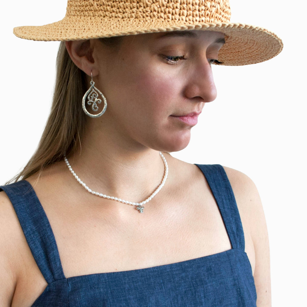Silver Dangle Earrings- artisan crafted of .925 sterling silver dangle earrings with an inner scrolled part that creates great movement. Shown on a model.