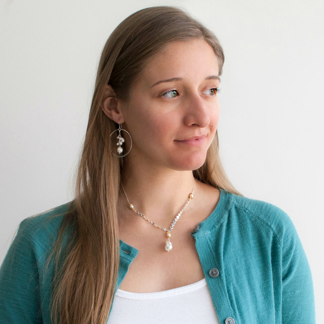 Baroque pearl necklace with sterling silver sequin chain, 22k gold plated accent beads. Shown on a model.