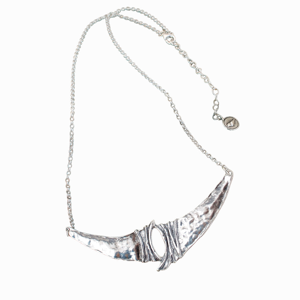 Elan sterling silver statement necklace with textured sculptural silver elements on a white background.