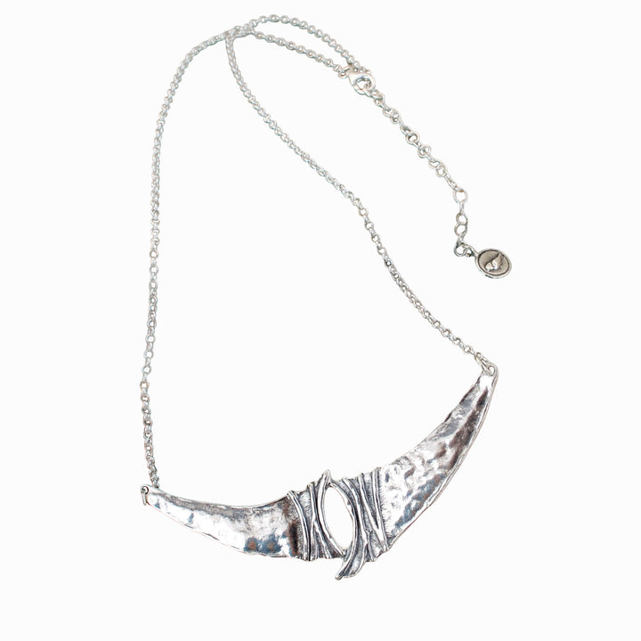 A sterling silver necklace, artisan-crafted, consisting of a sterling chain, a unique silver center link with a 2-inch extender. Shown on a white background.