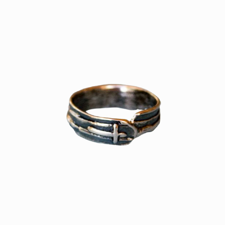 A sterling silver ring with a sideways cross design on a white background.