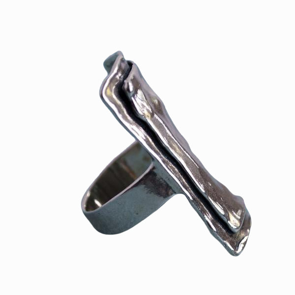 A sterling silver ring with a layered rectangle design is shown from the side on a white background. 