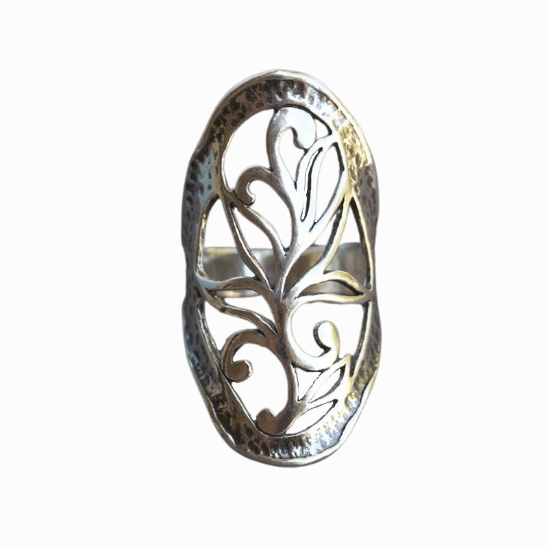 A sterling silver ring with intricate open scroll work, slightly oxidized for depth and detail, is shown from the front on a white background. 