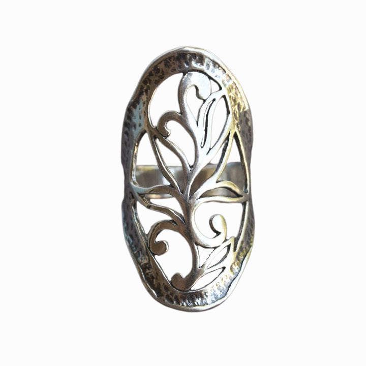 A sterling silver ring with intricate open scroll work, slightly oxidized for depth and detail, is shown from the front on a white background. 