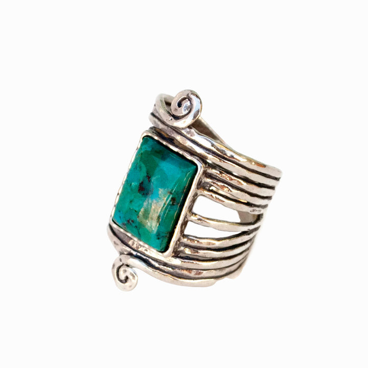 Silver turquoise ring with a rectangle cabochon of stabilized turquoise. Side view