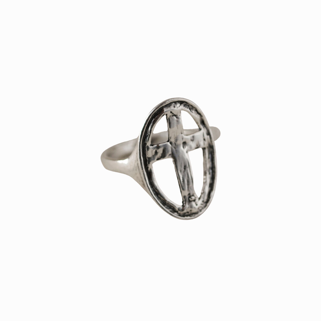 Cross Ring- crafted in .925 sterling silver, an open cross in an oval design is shown on a white background.  
