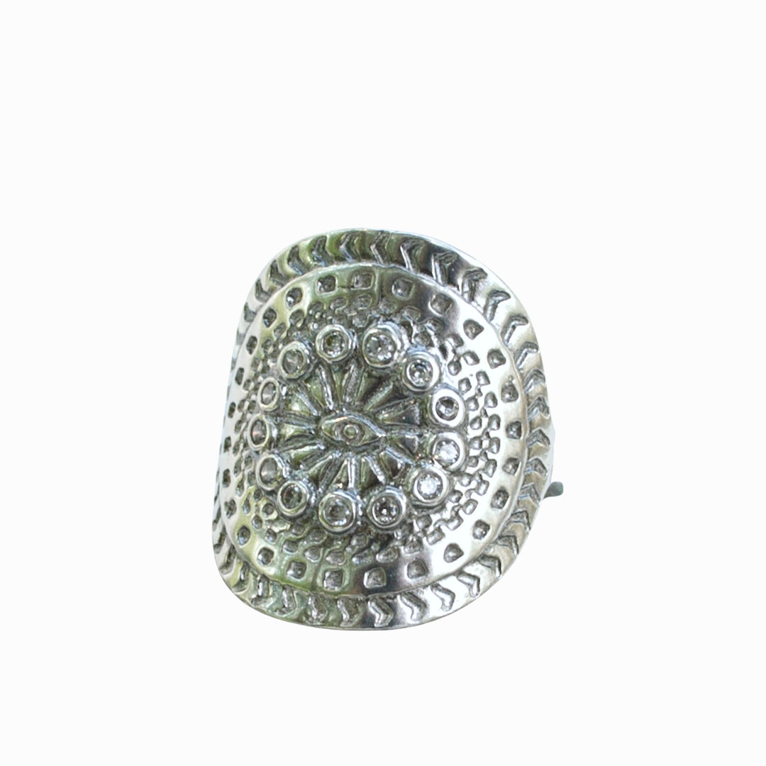 A sterling silver ring with a mandala design, featuring multiple clear cubic zirconia stones. Shown on a white background. 