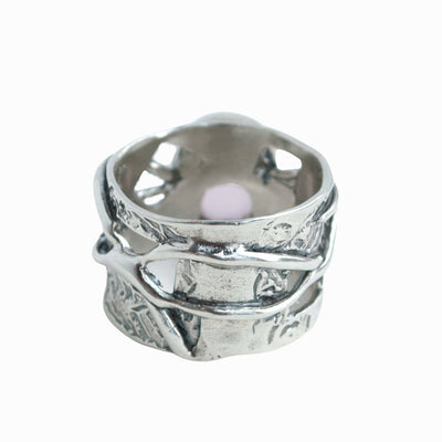 Pink Ring- .925 sterling silver ring with a faceted rose colored agate. Back View on a white background.