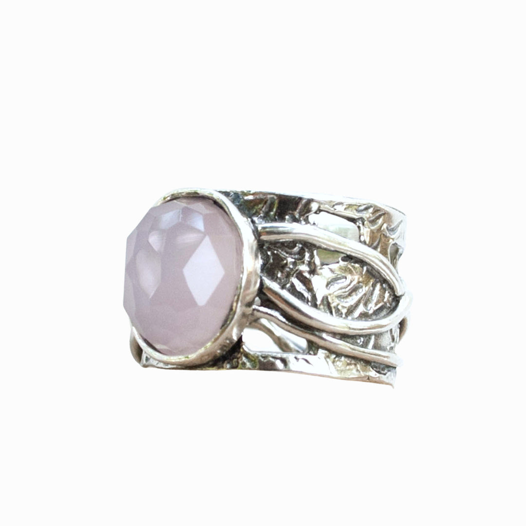 Pink Ring-.925 sterling silver ring with a faceted rose colored agate. Shown on a white background. 