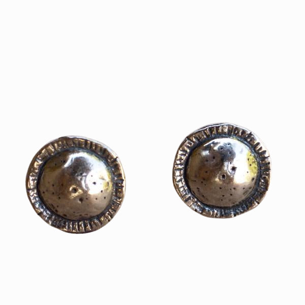 Round-textured sterling silver post earrings are shown from the front on a white background. 