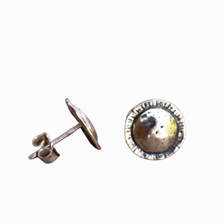 Round-textured sterling silver post earrings are shown on a white background, with a side and front view. 