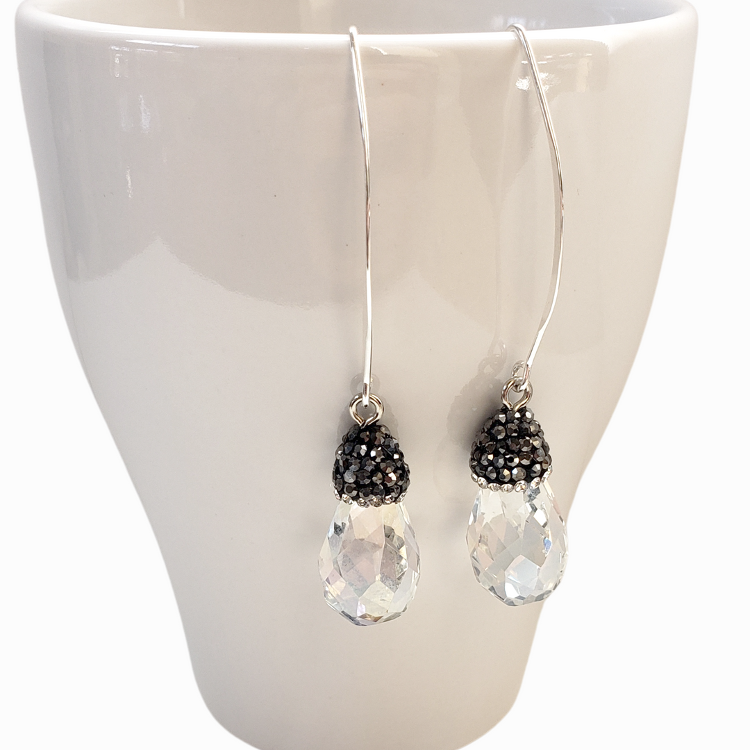 Earrings- long earrings with faceted crystal teardrops are topped with dainty cut crystals and finished on elongated sterling ear wires. They measure 2 1/4" long.