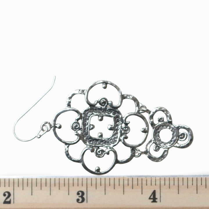 Silver Lace Earrings, one is shown by a ruler for scale. 2 1/2" long