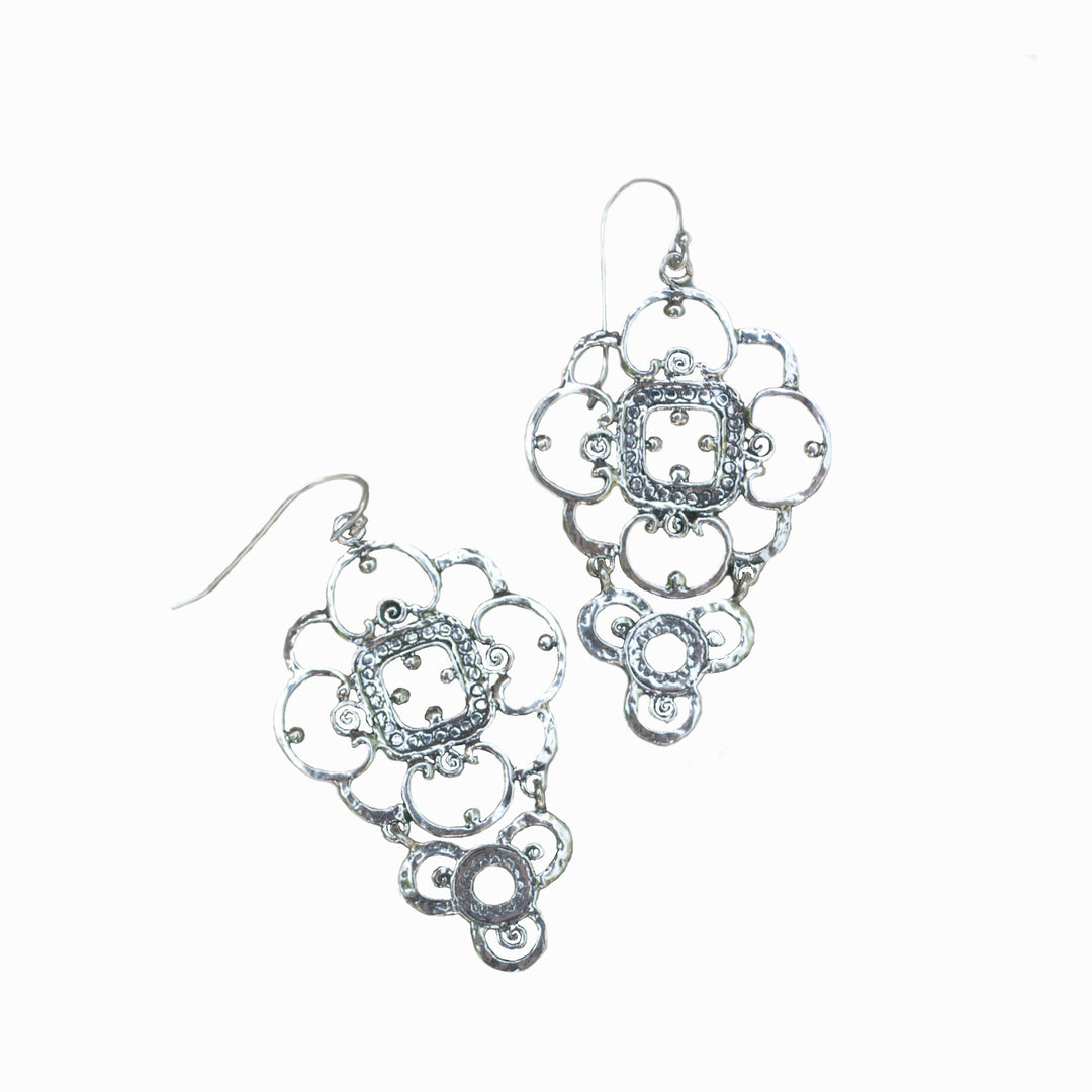 Sterling silver earrings with a lacey design. Shown flat on a white background. 