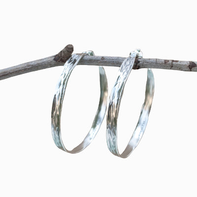 Earrings- Sterling Silver textured hoop earrings.