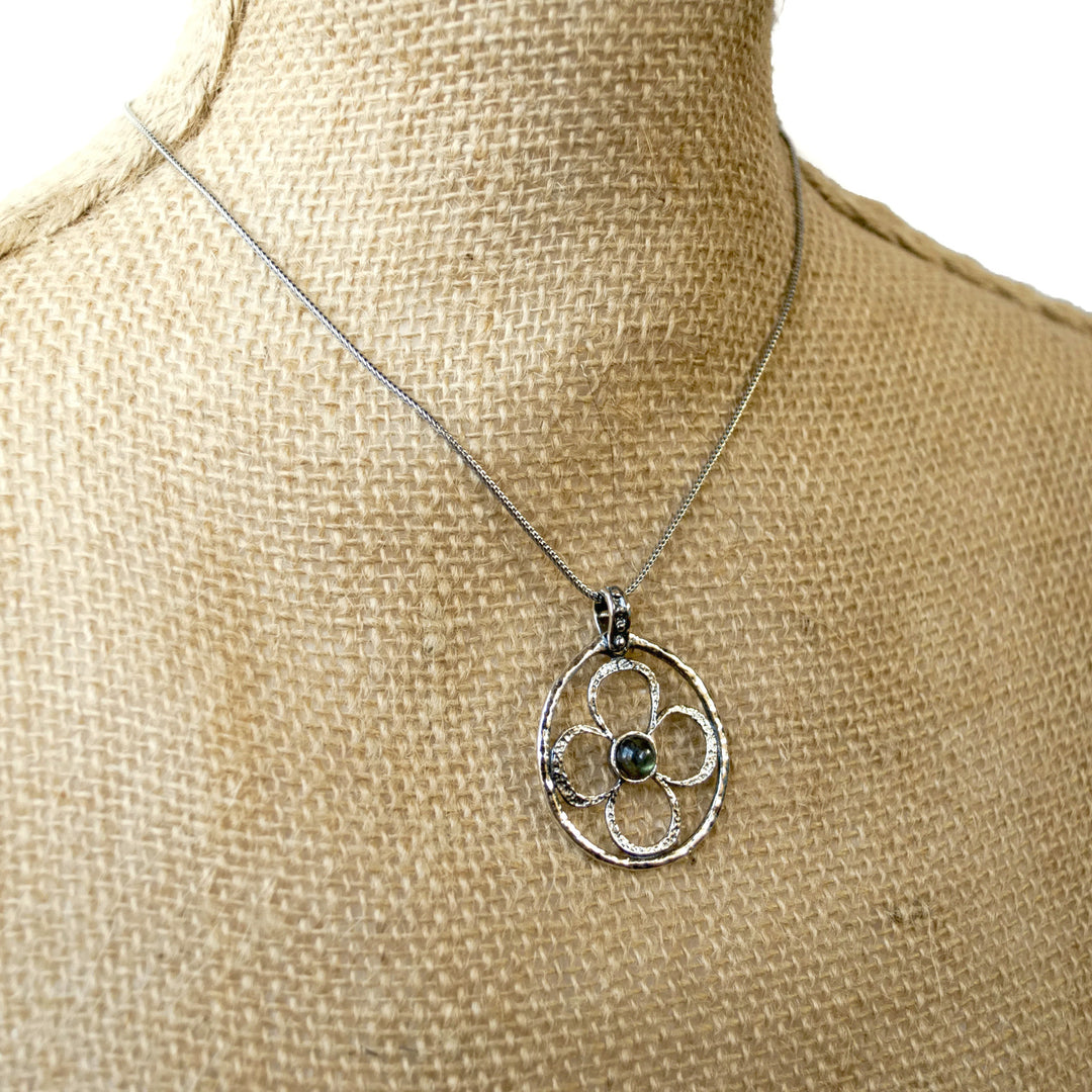 Sterling Silver Necklace With Flower Design and a Labradorite Center. Shown on a mannequin.